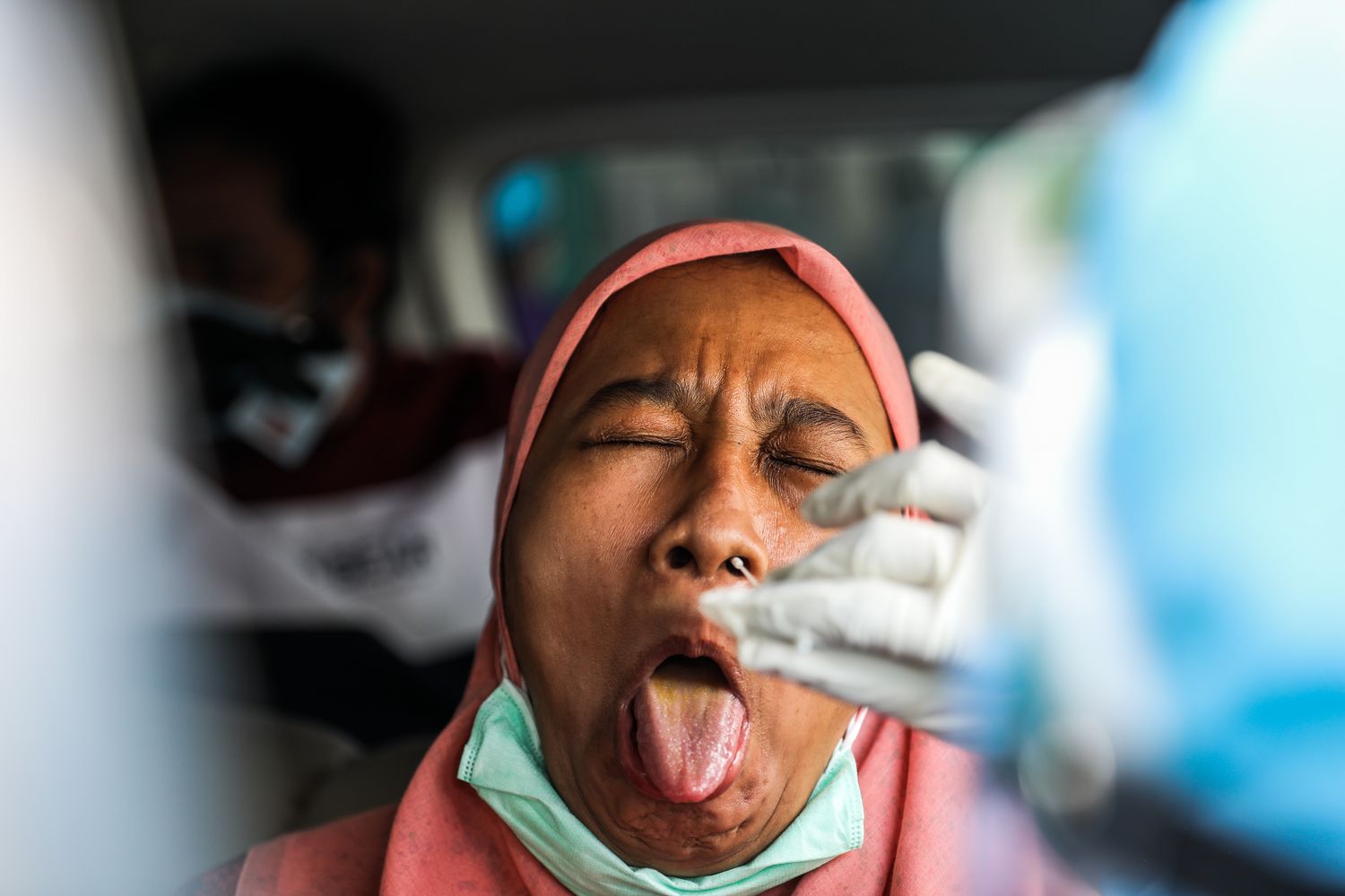 Funny Face Reaction Of A Woman Taking A PCR Test - Image From Garry ...